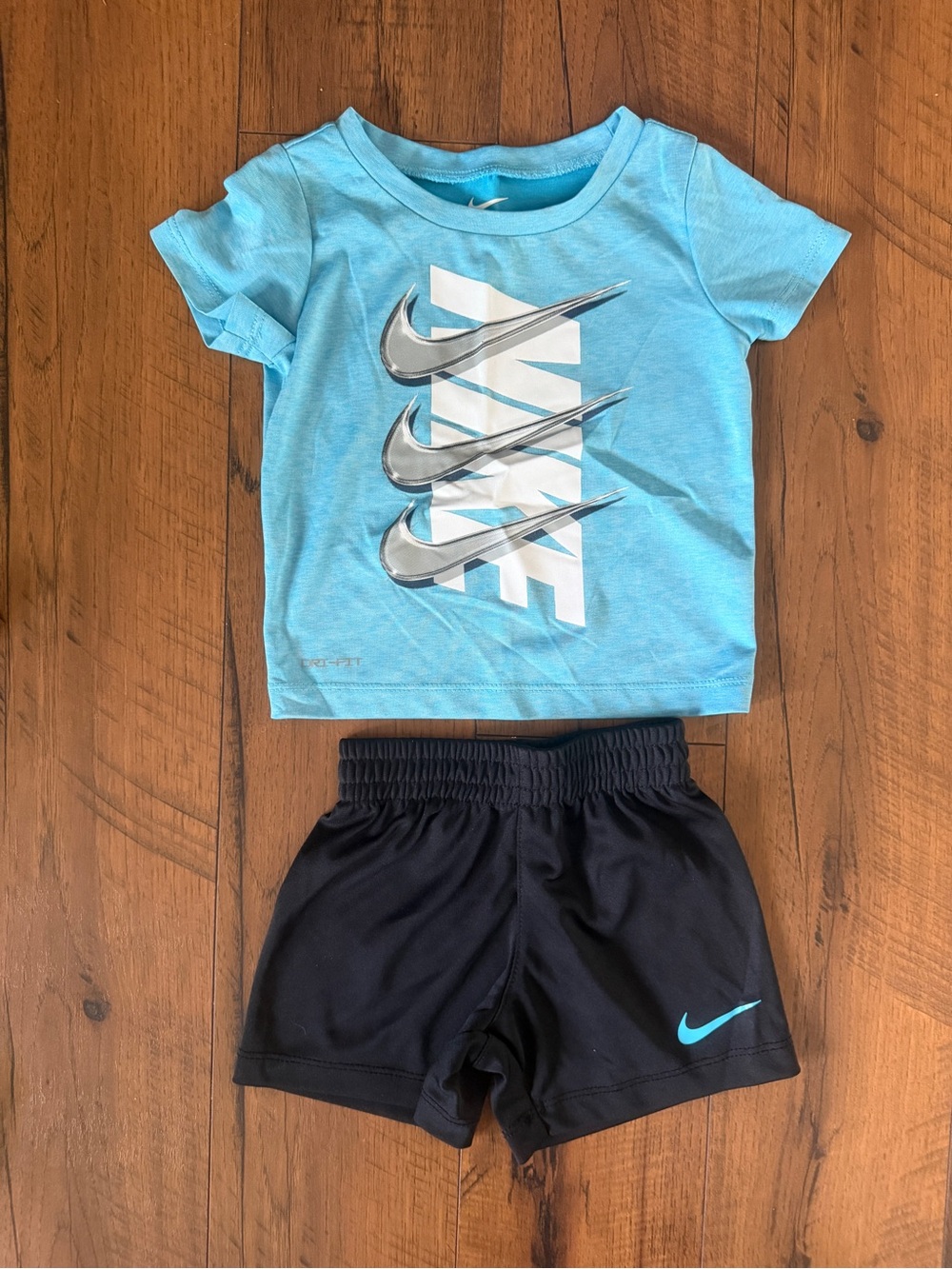 Nike Light Blue Graphic Tee with Black Athletic Shorts
